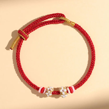 Chinese style, lily of the valley peach blossom bracelet hand-woven thousands of miles of rivers and mountains bracelet transfer beads red rope